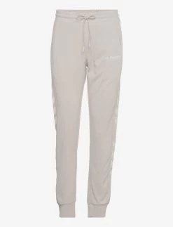 Hummel HmlLEGACY POLY WOMAN REGULAR PANTS - PUMICE STONE